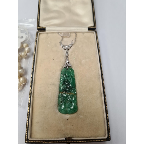 1071 - White metal chain with central diamond inset panel hung with carved jade pendant, AF, repaired, unma... 