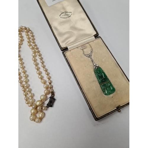 1071 - White metal chain with central diamond inset panel hung with carved jade pendant, AF, repaired, unma... 