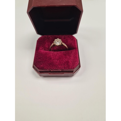 1042 - 9ct yellow gold dress ring with claw mounted round cut clear stone marked 375, size M, approx 2.4g