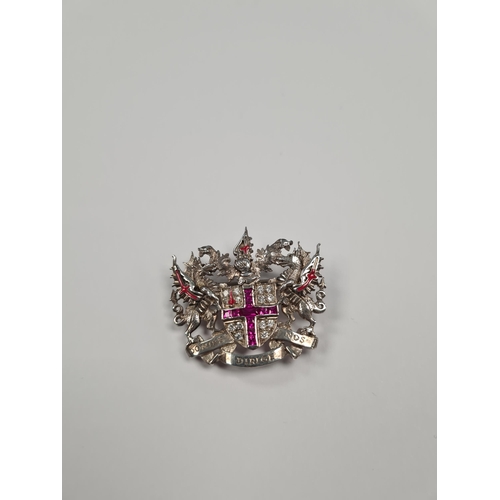 1052 - A silver 'City of London' brooch, central shield set synthetic rubies in a cross and clear stones, f... 