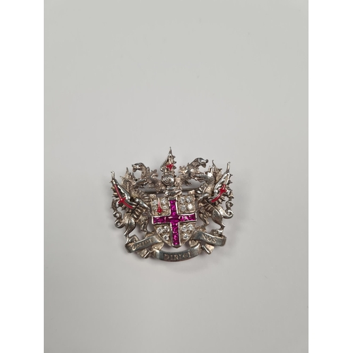 1052 - A silver 'City of London' brooch, central shield set synthetic rubies in a cross and clear stones, f... 