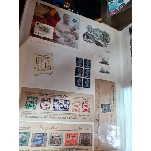 161 - Three stamp albums, mainly Worldwide, one specifically Germany