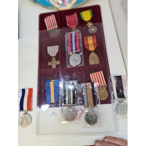 519 - A collection of World War 1 & II medals and others including Belgium, Australia and India examples