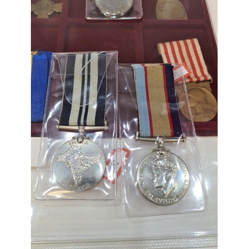 519 - A collection of World War 1 & II medals and others including Belgium, Australia and India examples