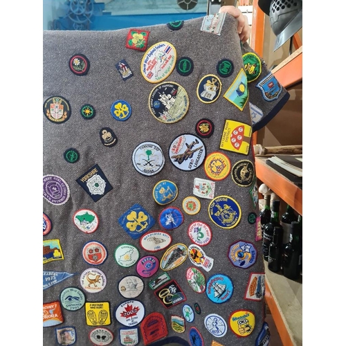 110 - Of Guiding interest; interesting blanket/Poncho covered in Group Badges, including GB and Worldwide ... 