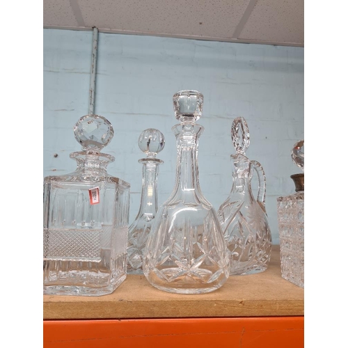 117 - Quantity of decanters including an example with silver collar and one by Edinburgh,(8)