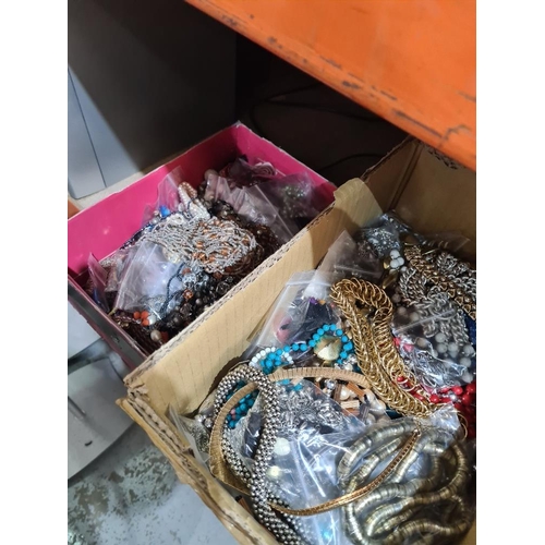 166 - Two small boxes of costume jewellery