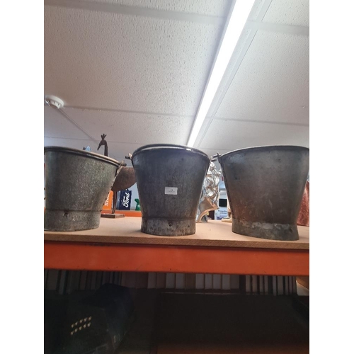 240 - Three metal graduated buckets