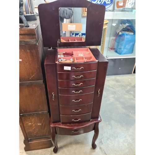 86 - Reproduction jewellery chest with central doors and cupboards