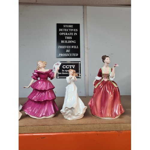 95 - 9 Royal Doulton figures of ladies