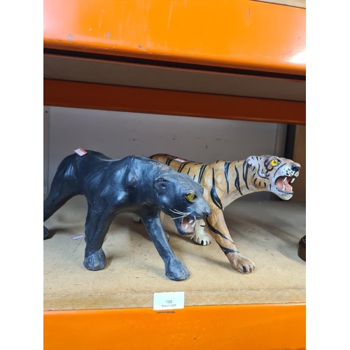 102 - Two leather covered wildcats, tiger and panther