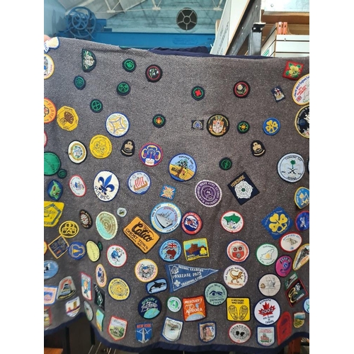 110 - Of Guiding interest; interesting blanket/Poncho covered in Group Badges, including GB and Worldwide ... 