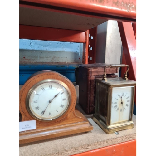 139 - Brass carriage clock with leather fitted case and 2 other clocks