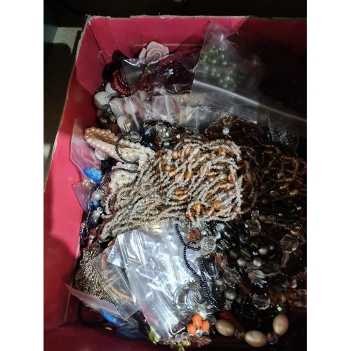 166 - Two small boxes of costume jewellery