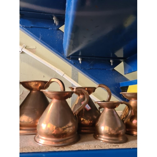 17 - Two old Copper kettles and 5 graduated measures