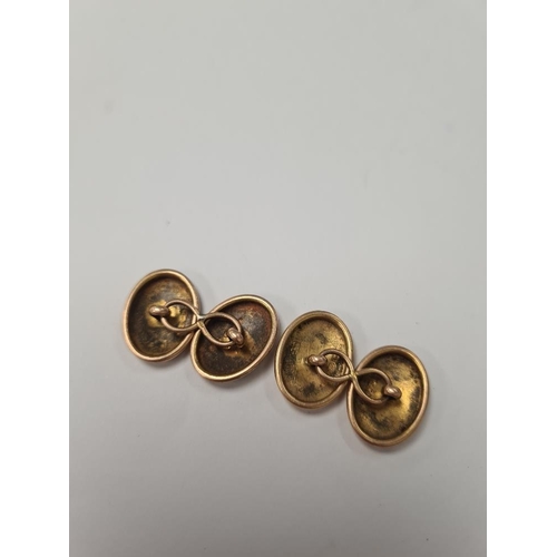 1018 - Pair of 15ct yellow gold oval cufflinks marked .625, with engraved decoration, approx 6.6g