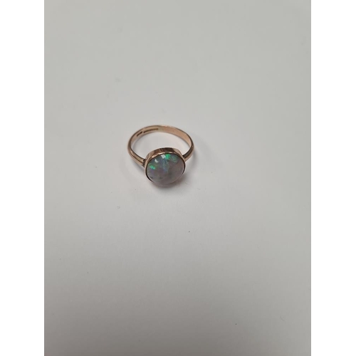 1024 - Pretty 9ct rose gold dress ring with large circular Opal in rubover setting, size O, approx 2.8g