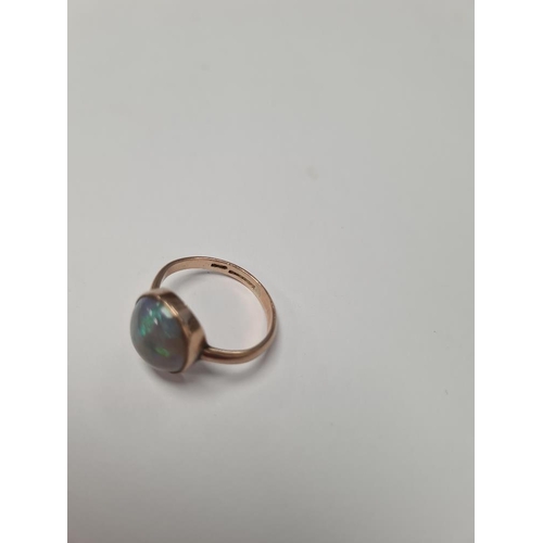 1024 - Pretty 9ct rose gold dress ring with large circular Opal in rubover setting, size O, approx 2.8g