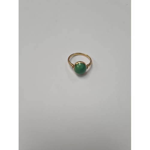 1025 - 18ct yellow gold dress ring, with large cabouchon green hardstone, size Q, marked 18ct, 4.16g approx