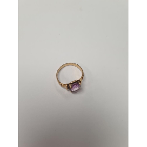 1026 - Unmarked yellow gold, possibly 18ct dress ring with 4 claw mounted mixed cut amethyst on stepped sho... 