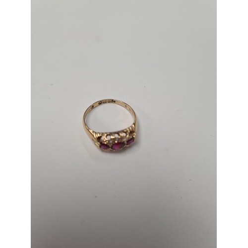 1029 - 18ct yellow gold ring with 3 round cut rubies in diamond chip inset frame, marked 18, Birmingham, si... 