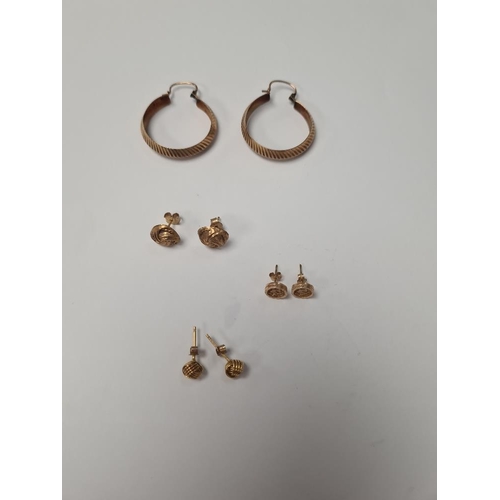 1057 - Pair of 9ct yellow gold hoops, 2 pairs of 9ct knot design ear studs and pair of 'St Christopher' ear... 