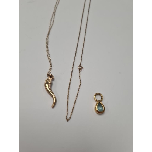 1059 - Fine 9ct yellow gold chains, one hung with a pendant, and another 9ct gold pendant set with blue top... 