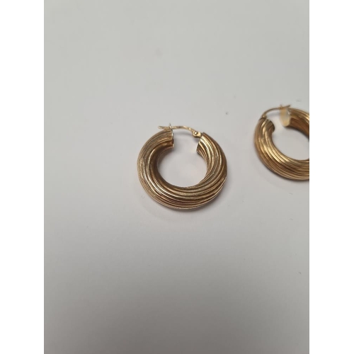 1011 - Pair of 9ct yellow gold hoop earrings, 2.5cm diameter, marked 375, approx 4g