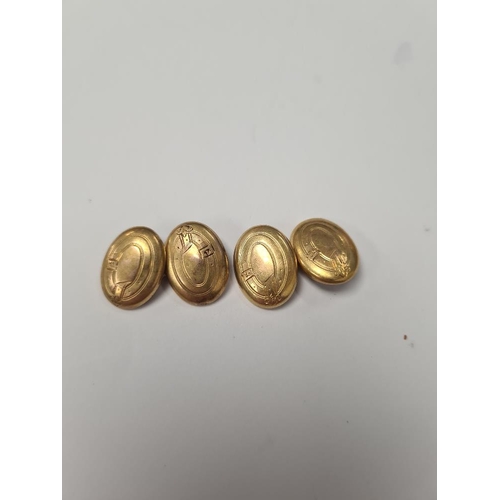 1018 - Pair of 15ct yellow gold oval cufflinks marked .625, with engraved decoration, approx 6.6g