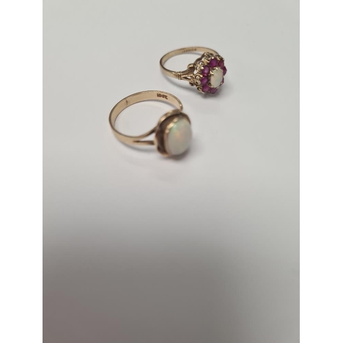 1040 - Pretty 9ct ruby and opal cluster ring with central oval opal surrounded rubies, marked 375, size O, ... 