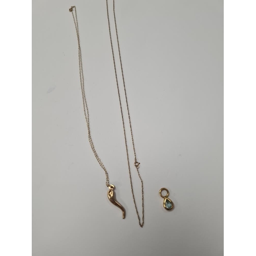 1059 - Fine 9ct yellow gold chains, one hung with a pendant, and another 9ct gold pendant set with blue top... 