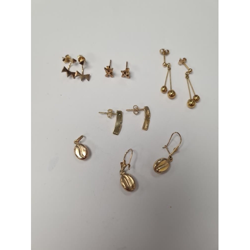 1065 - Six pairs of 9ct yellow gold earrings, and a 9ct gold pendant, 5.32g approx