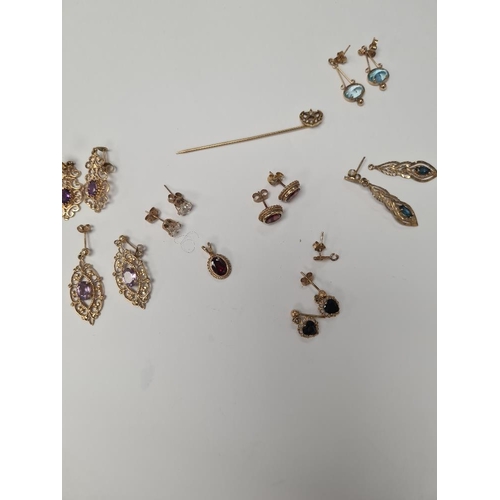 1071 - Quantity of 9ct yellow gem set earrings and pendants, to include a Victorian stick pin with crescent... 