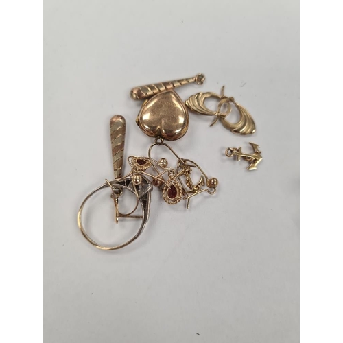 1129 - Quantity of 9ct yellow gold earrings, rolled gold heart shaped locket and ring, approx 8.13g