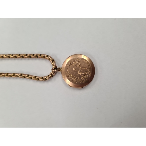 1162 - 9ct yellow gold belcher chain, unmarked, hung with a circular gold locket engraved with bird and flo... 