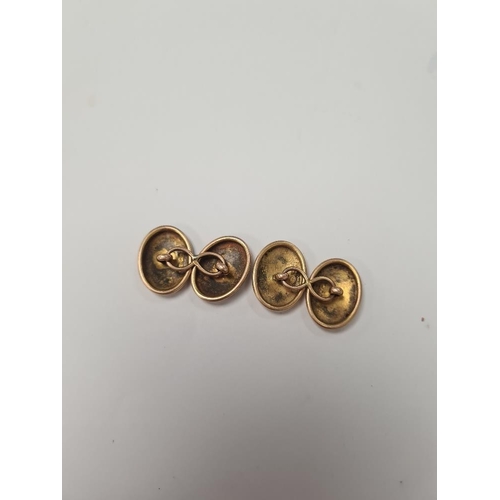 1018 - Pair of 15ct yellow gold oval cufflinks marked .625, with engraved decoration, approx 6.6g