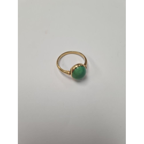 1025 - 18ct yellow gold dress ring, with large cabouchon green hardstone, size Q, marked 18ct, 4.16g approx