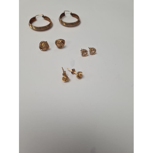 1057 - Pair of 9ct yellow gold hoops, 2 pairs of 9ct knot design ear studs and pair of 'St Christopher' ear... 