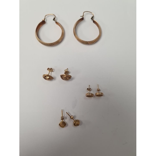 1057 - Pair of 9ct yellow gold hoops, 2 pairs of 9ct knot design ear studs and pair of 'St Christopher' ear... 