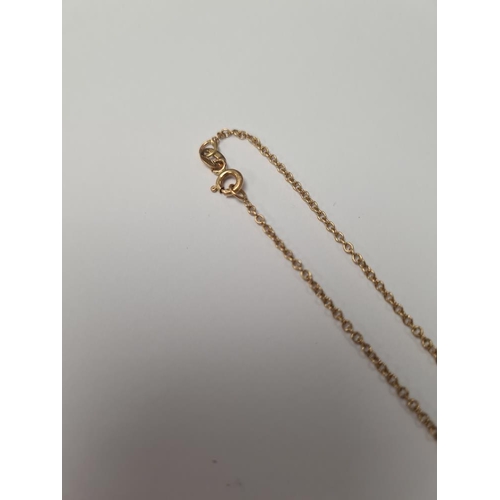 1058 - 18ct yellow gold fine neckchain hung with a 9ct gold heart pendant, marked 375, chain marked 750, ap... 