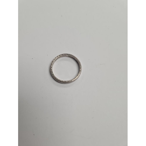 1102 - Platinum wedding band with engraved worn pattern, size L, marked PLATINUM, approx 3g