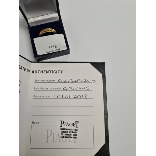 1118 - Piaget: An 18ct yellow gold 'Possession ring' by Piaget, set with 7 brilliant cut diamonds, with cer... 