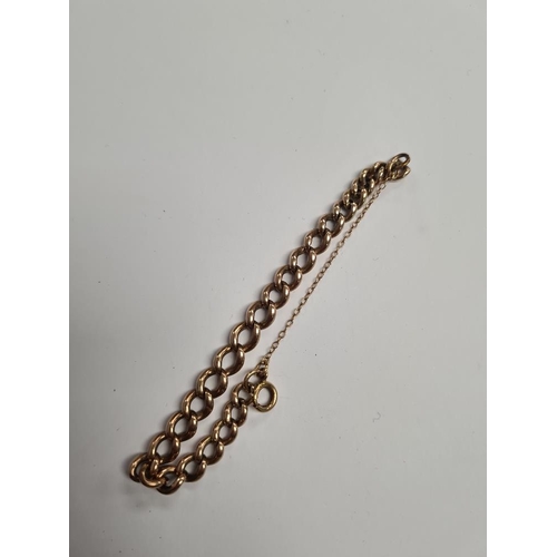 1121 - Unmarked yellow gold curb link bracelet, marks worn, with safety chain, approx 19.24g 