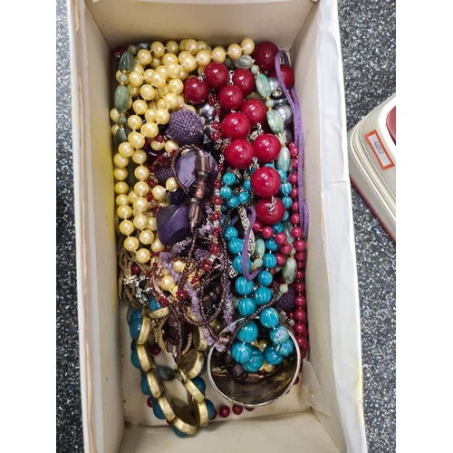 1200 - A jewellery box containing vintage costume jewellery and a box of bead necklaces