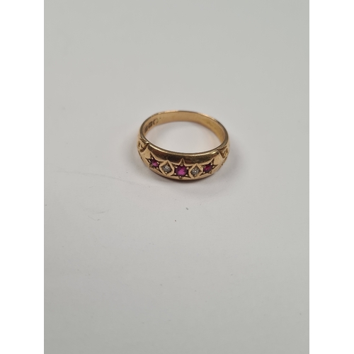 1012A - 18ct yellow gold ruby and diamond band ring, all starburst set, marked 18, Birmingham, size M, 3g.