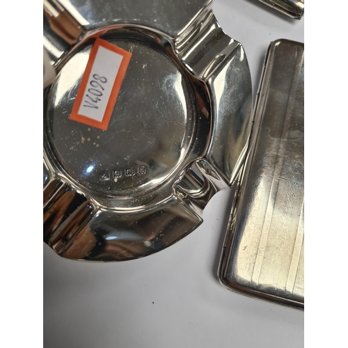 1 - Two silver cigarette cases of striped design, one having dated cartouche, the other, vacant. Also wi... 