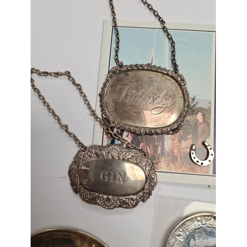 10 - A mixed lot comprising silver topped amber cheroot, decanter labels, coins including four silver exa... 