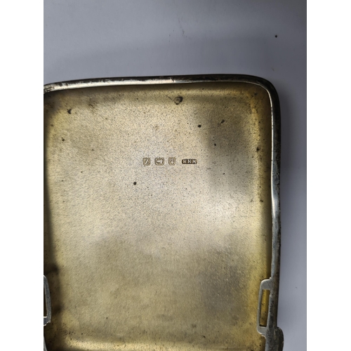 15 - A cigarette case having gilt interior and engraved with a dragon on the exterior, marked AH800 insid... 