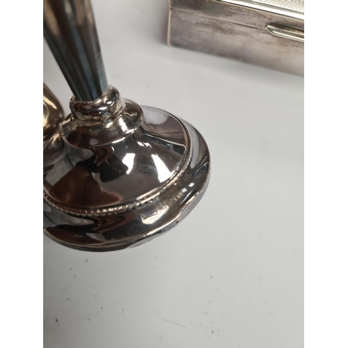 18 - A quantity of silver weighted candlesticks having beaded raised pedestal circular foot. Hallmarked B... 