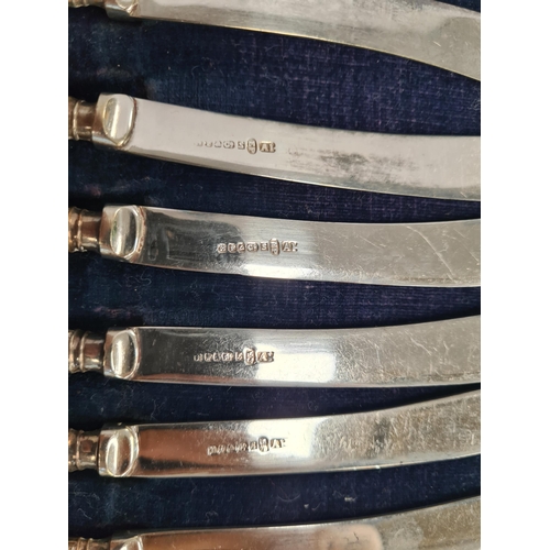 2 - A cased set of silver handled knives by Harrison Fisher and Co. Also with a brooch, on silver and Mo... 